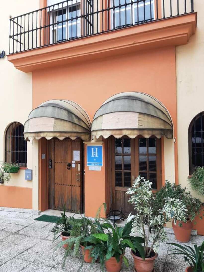 Entrance doors of Sotel Valle Guadiaro with awnings and plants